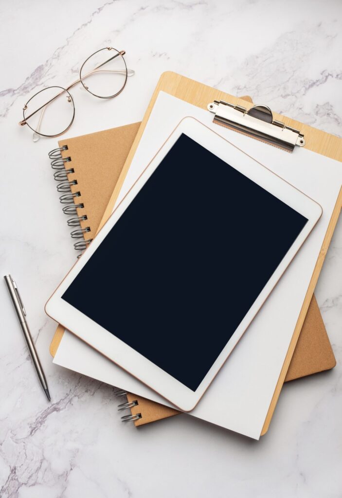 Tablet pc and notebooks on the office desk